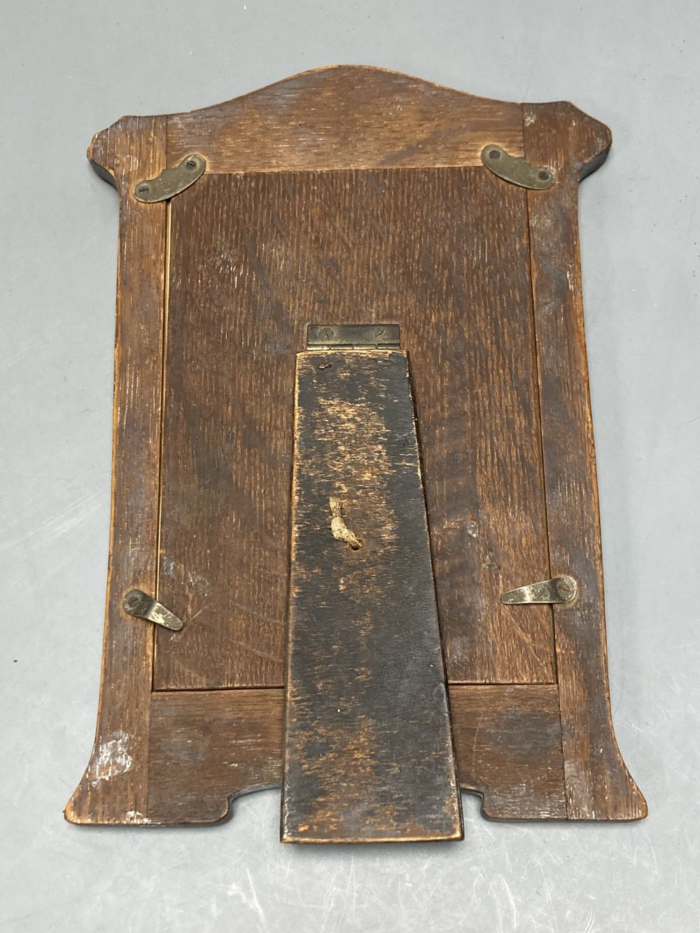 An Edwardian silver mounted photograph frame, Birmingham, 1906, 22.2cm(a.f.) and two others.